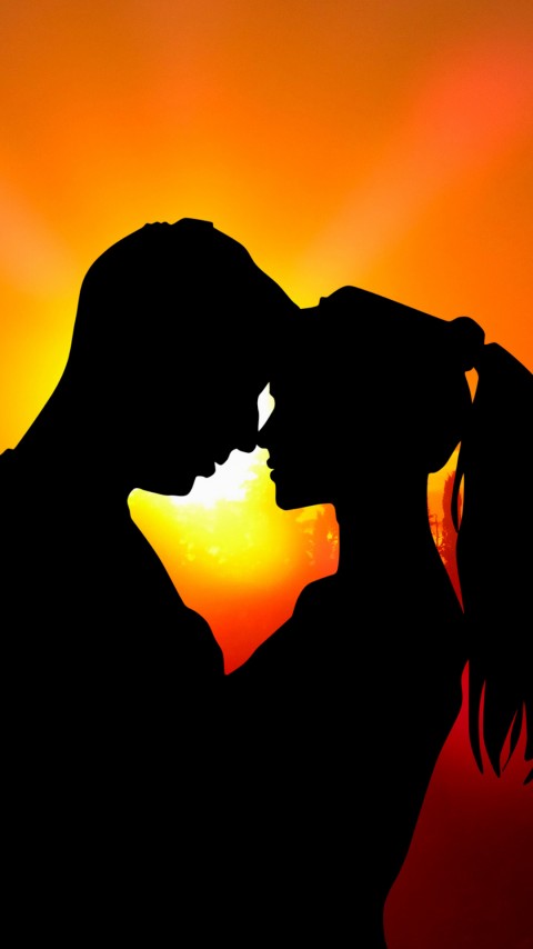 Free Couple At Burning Sunset Wallpaper For Mobile