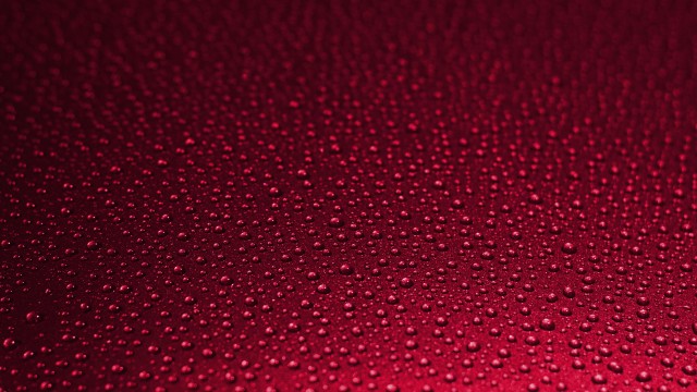 Water Drops In Red Background 5K Wallpaper